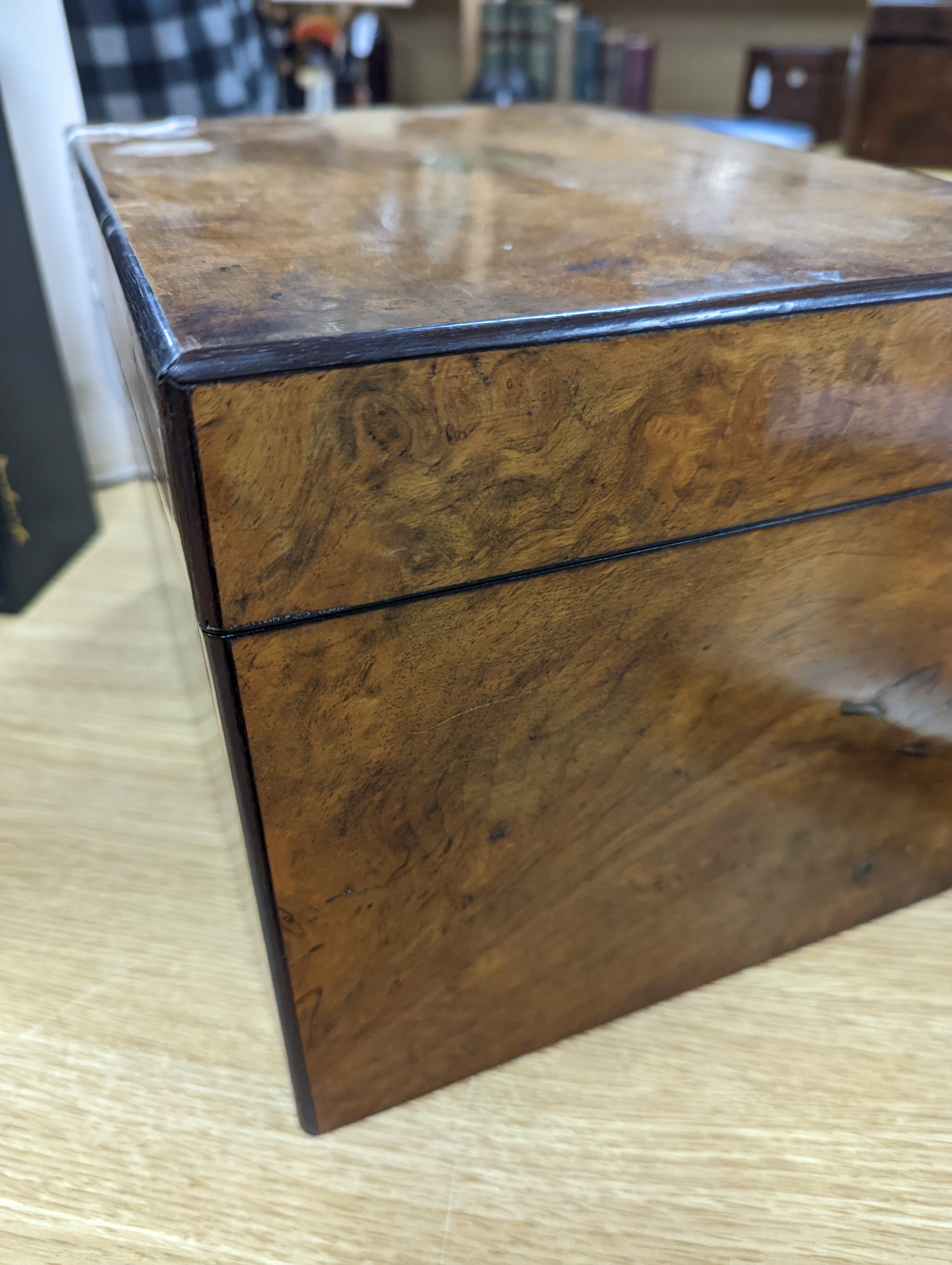 A Victorian walnut sewing casket, 34cm, containing sewing related accessories
